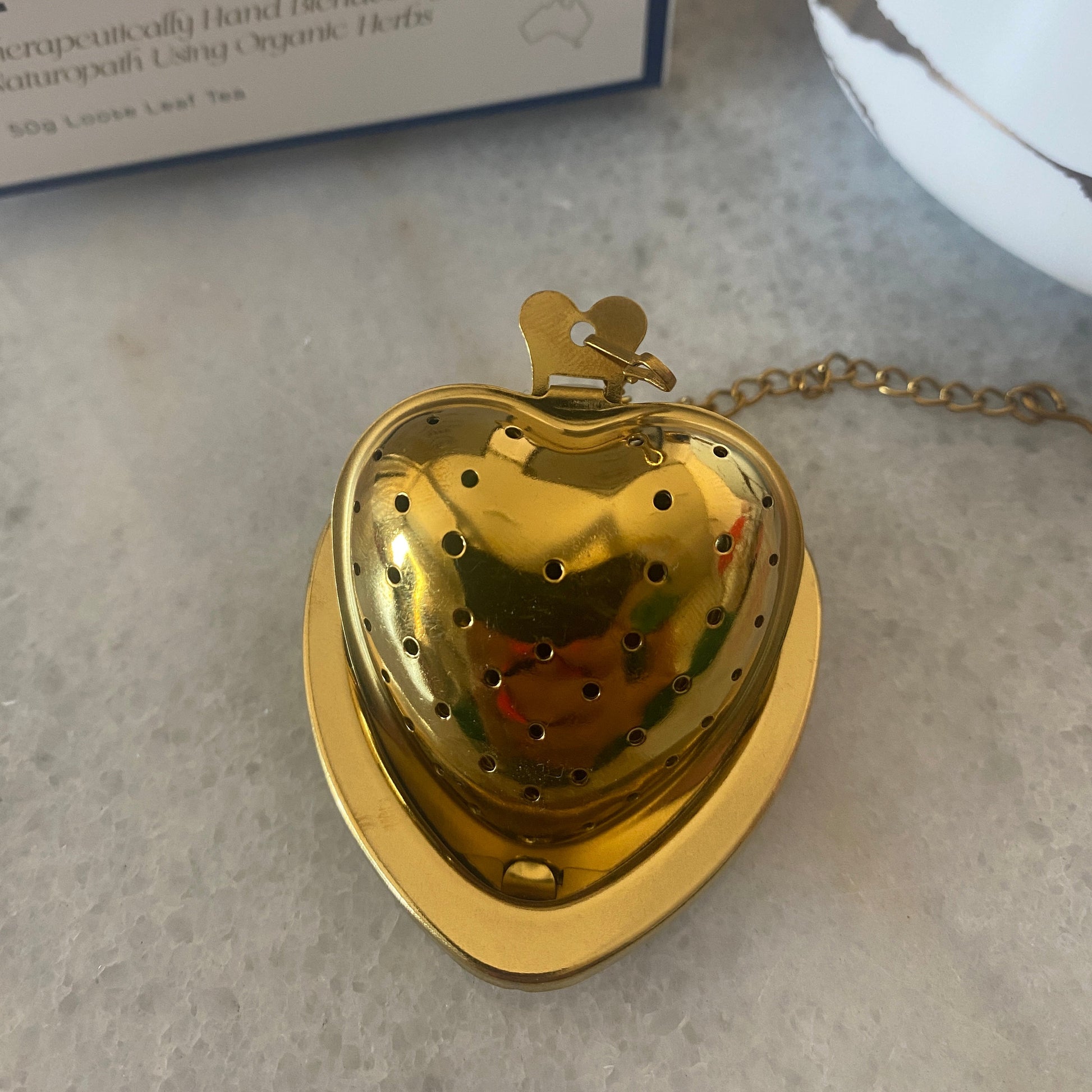 Athella Heart Shaped Tea Strainer on Resting Plate