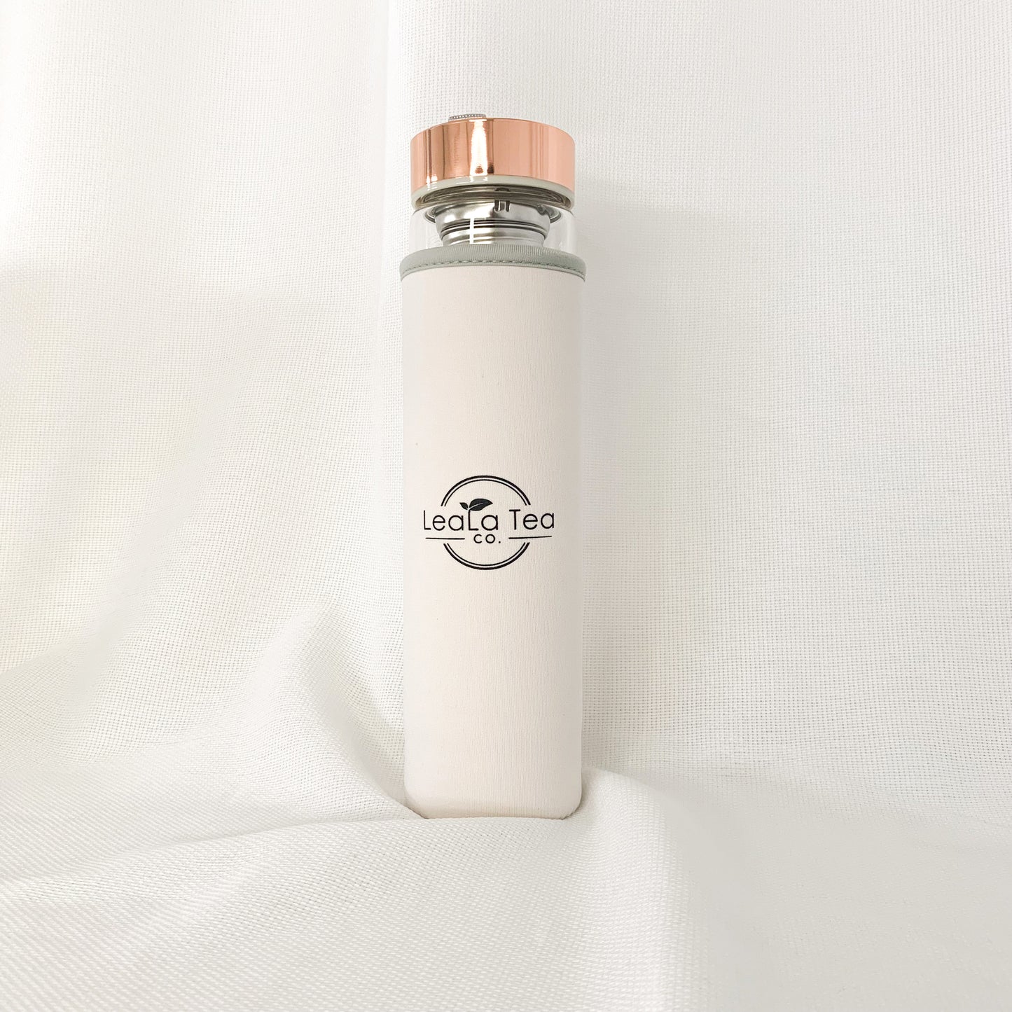 Crystal Tea Infuser Bottle with white protective sleeve.