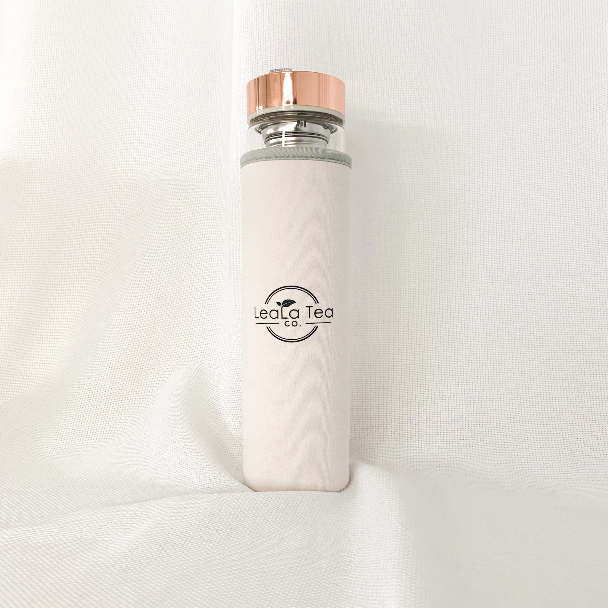 Crystal Tea Infuser Bottle with white protective sleeve.