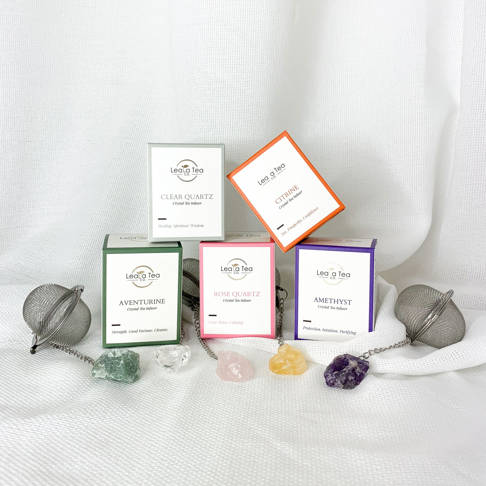Complete Athella Crystal Tea Infuser collection stacked in pyramid.