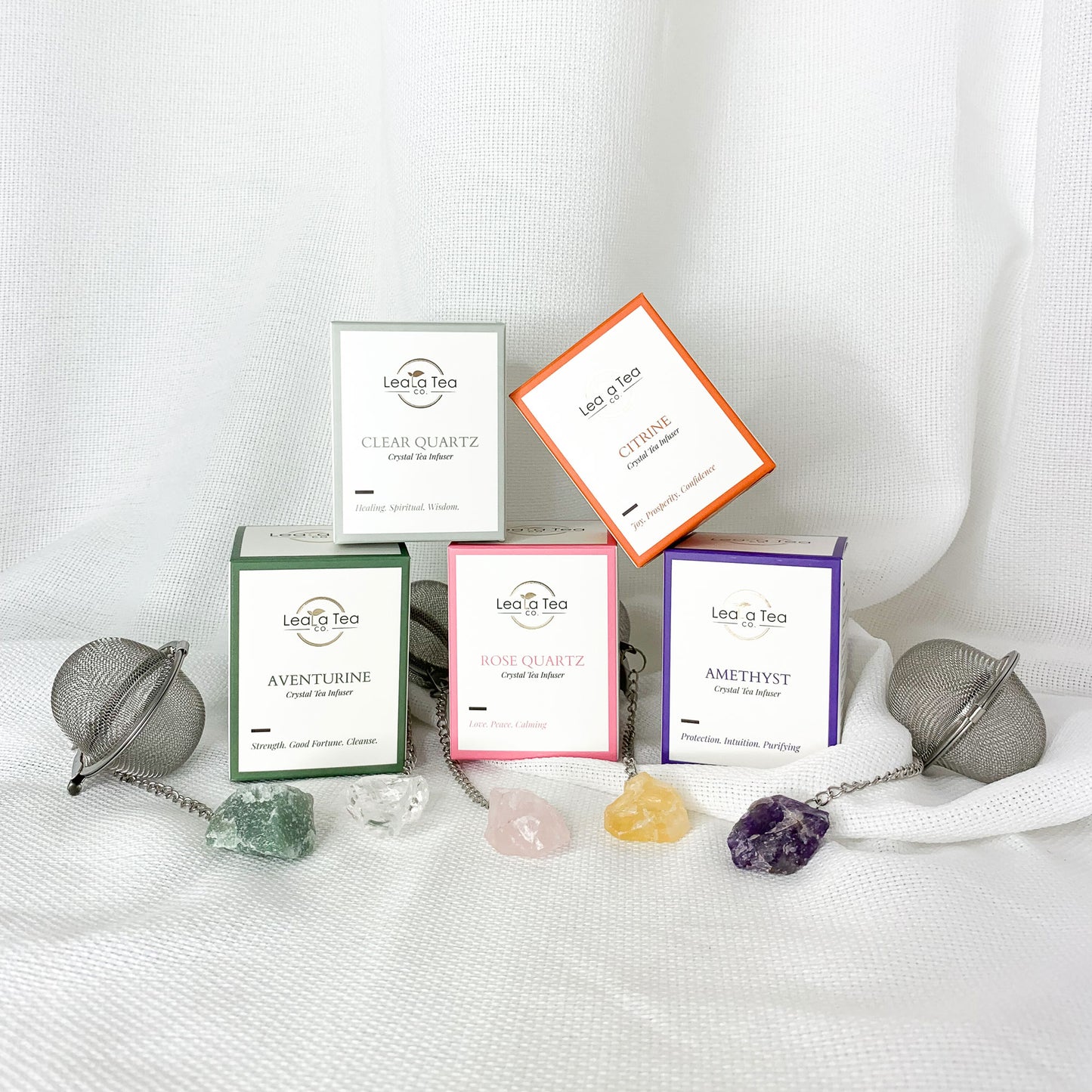 Complete Crystal Tea Infuser collection stacked on top of eachother in pyramid.